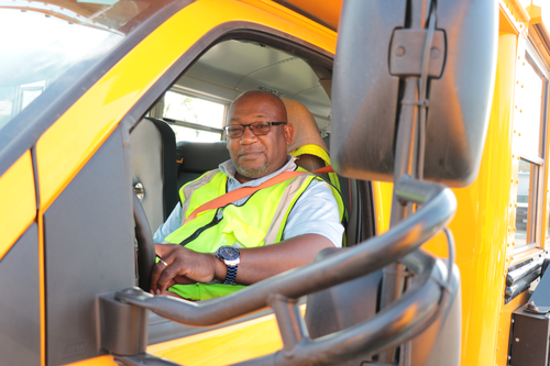 Bus driver sitting in vehicle